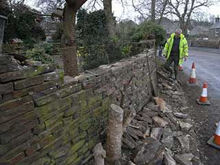 Curved wall adjoining road